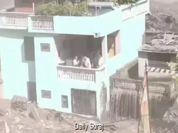 Nepal Floods: House Stands Amid Raging Waters and Debris, Three People Survive on Balcony