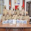 TWO LINKED TO CROSS-BORDER SMUGGLING MODULE HELD WITH 6 SOPHISTICATED PISTOLS, 1KG HEROIN, ₹10K DRUG MONEY